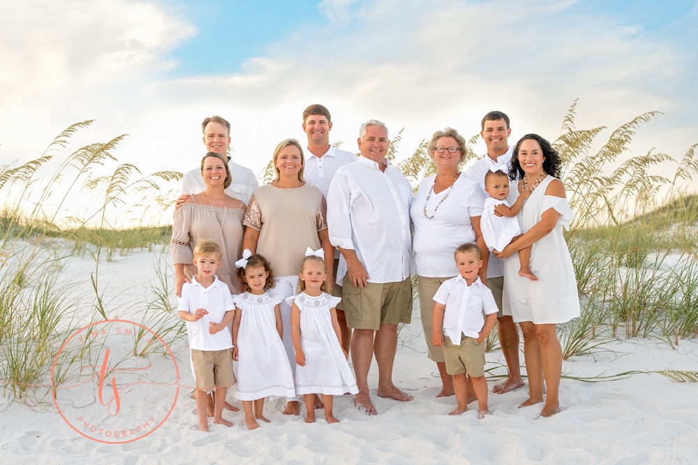 tina smith destin photographer family beach portrait wearing tan shorts and white