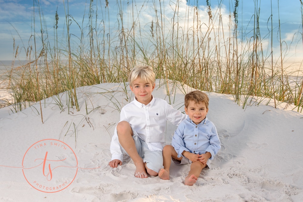 Destin photographer capturing portrait of kids on sand dune