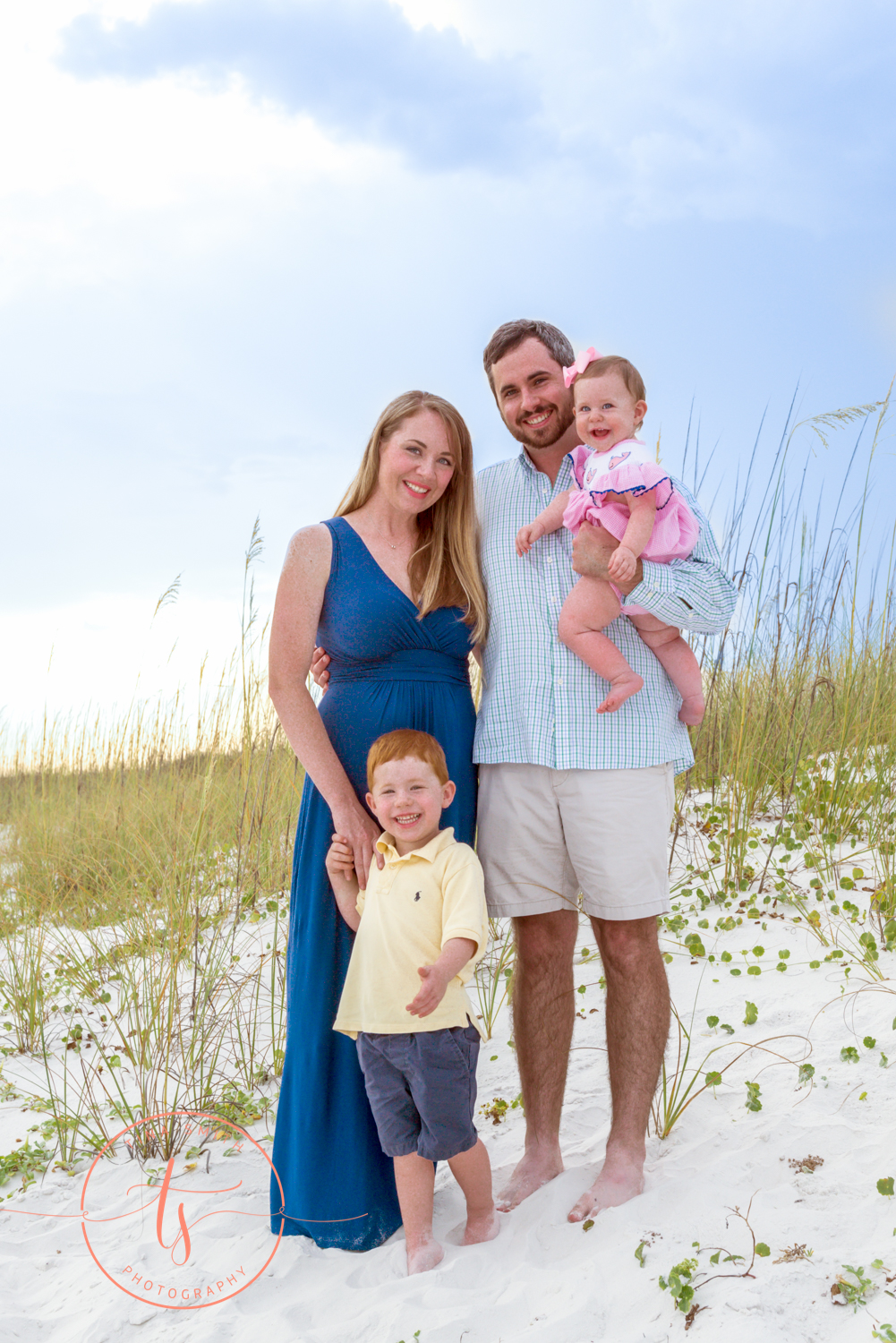 destin family posing on beach for portraits