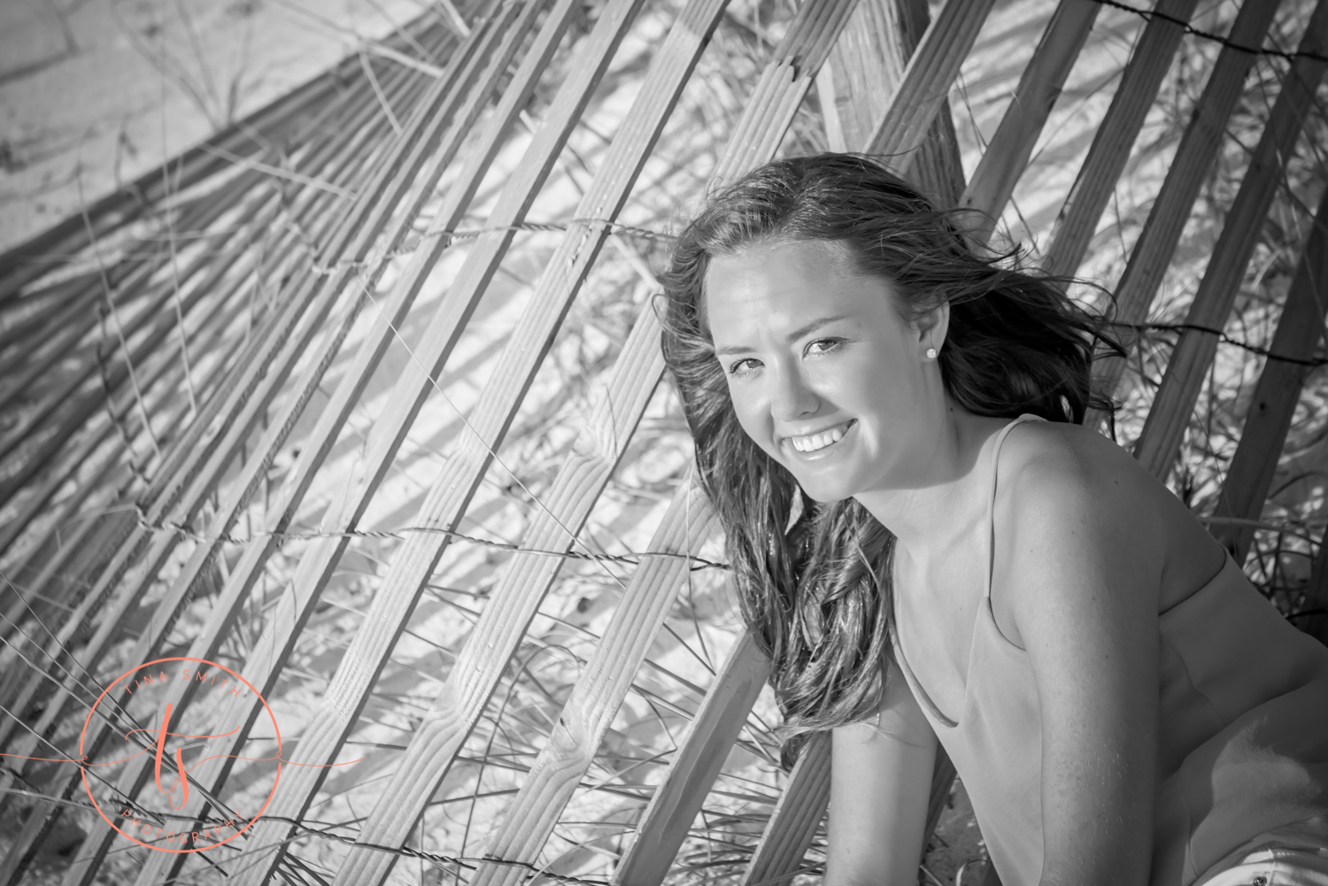 girl posing for senior portraits on beach in destin