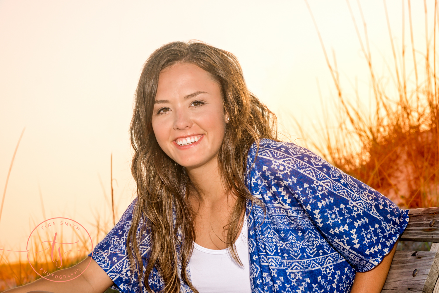 girl posing on beach at sunset in destin for senior portraits