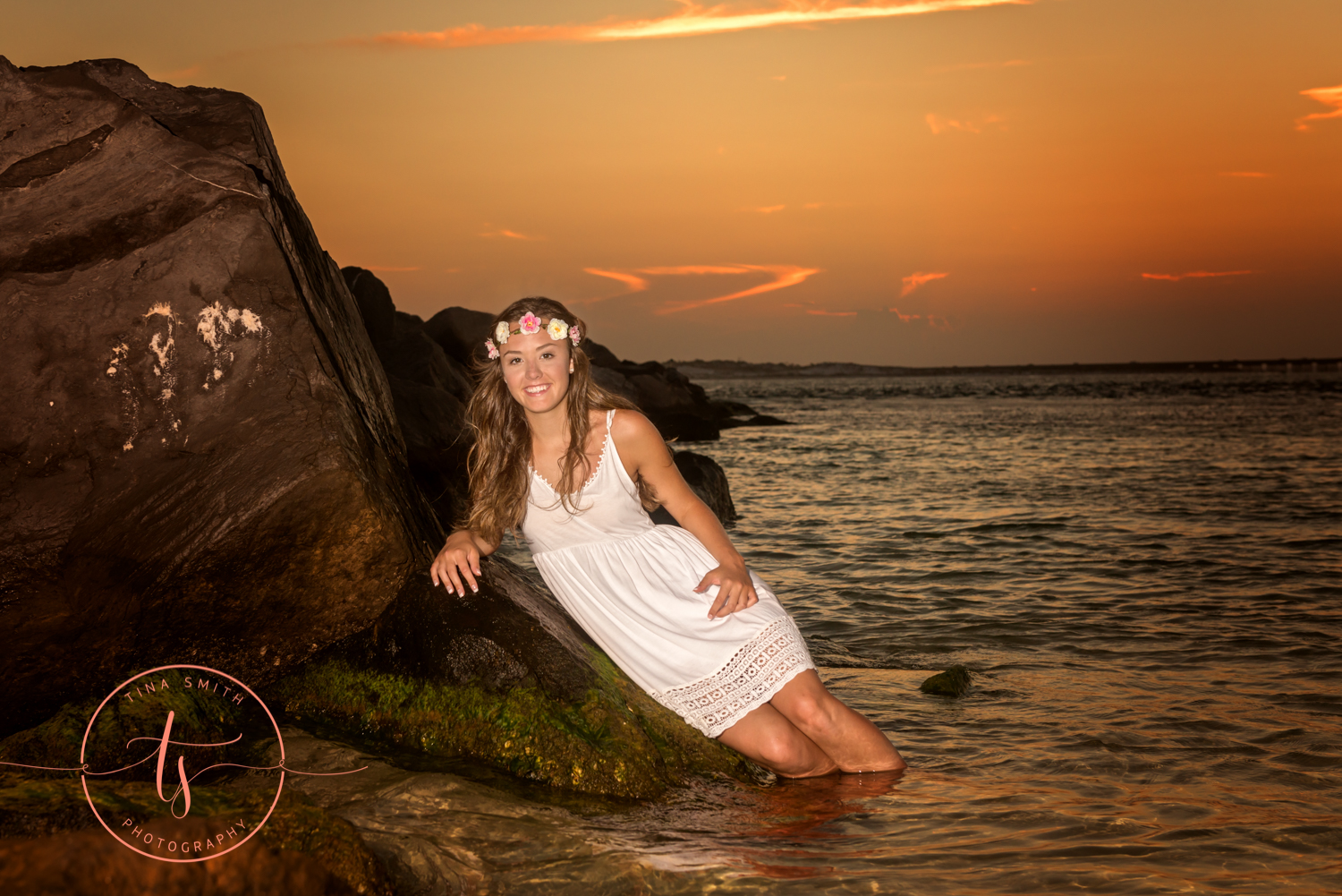 girl posing on a rock in water in destin 