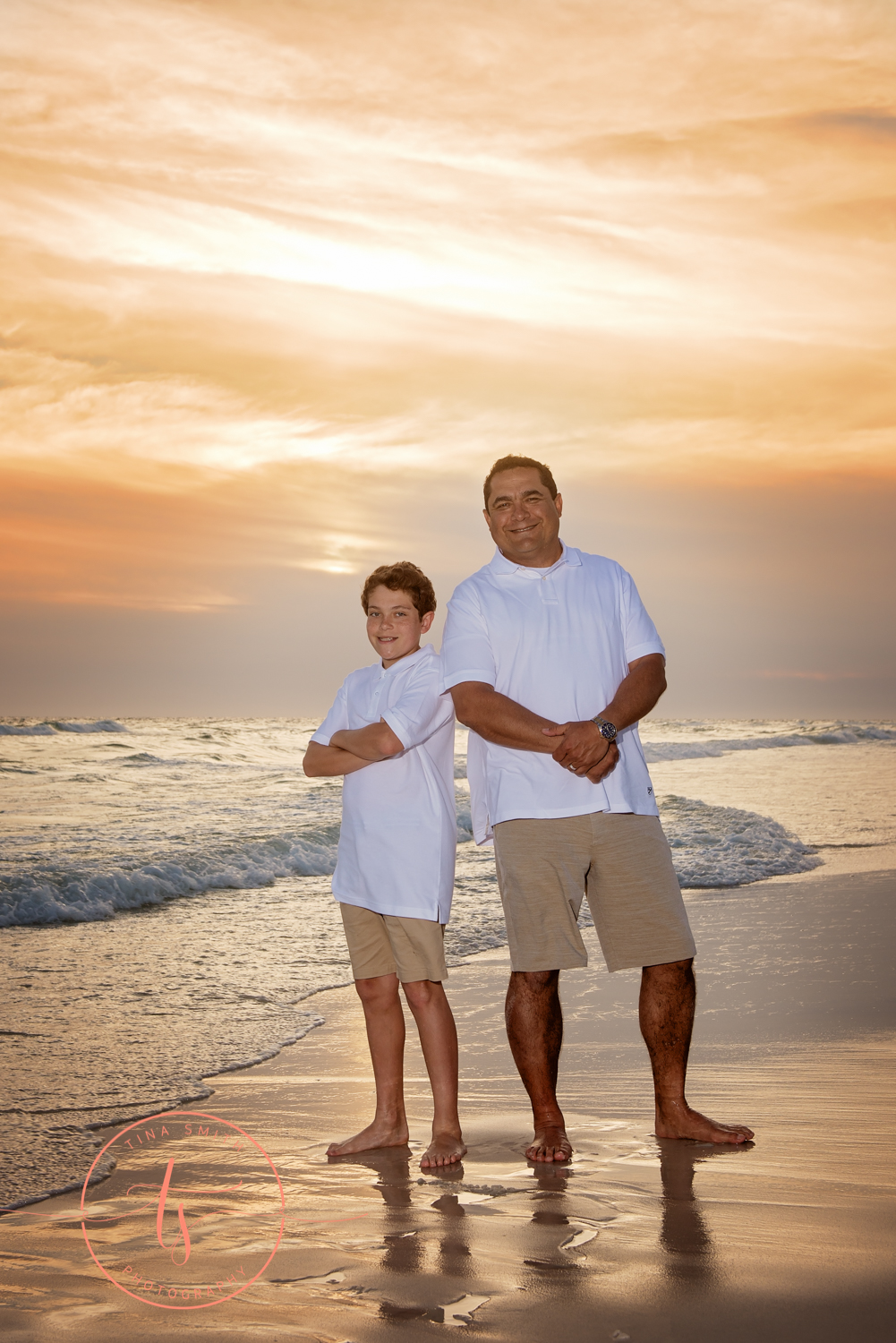 dad and son posing at sunset on watersound beach photographer