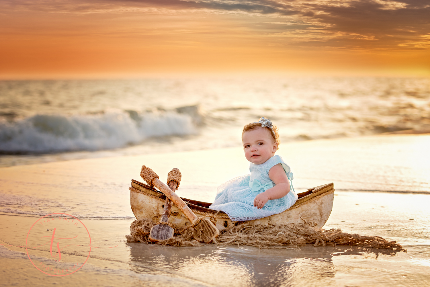 baby in a canoe in the water at the beach in destin