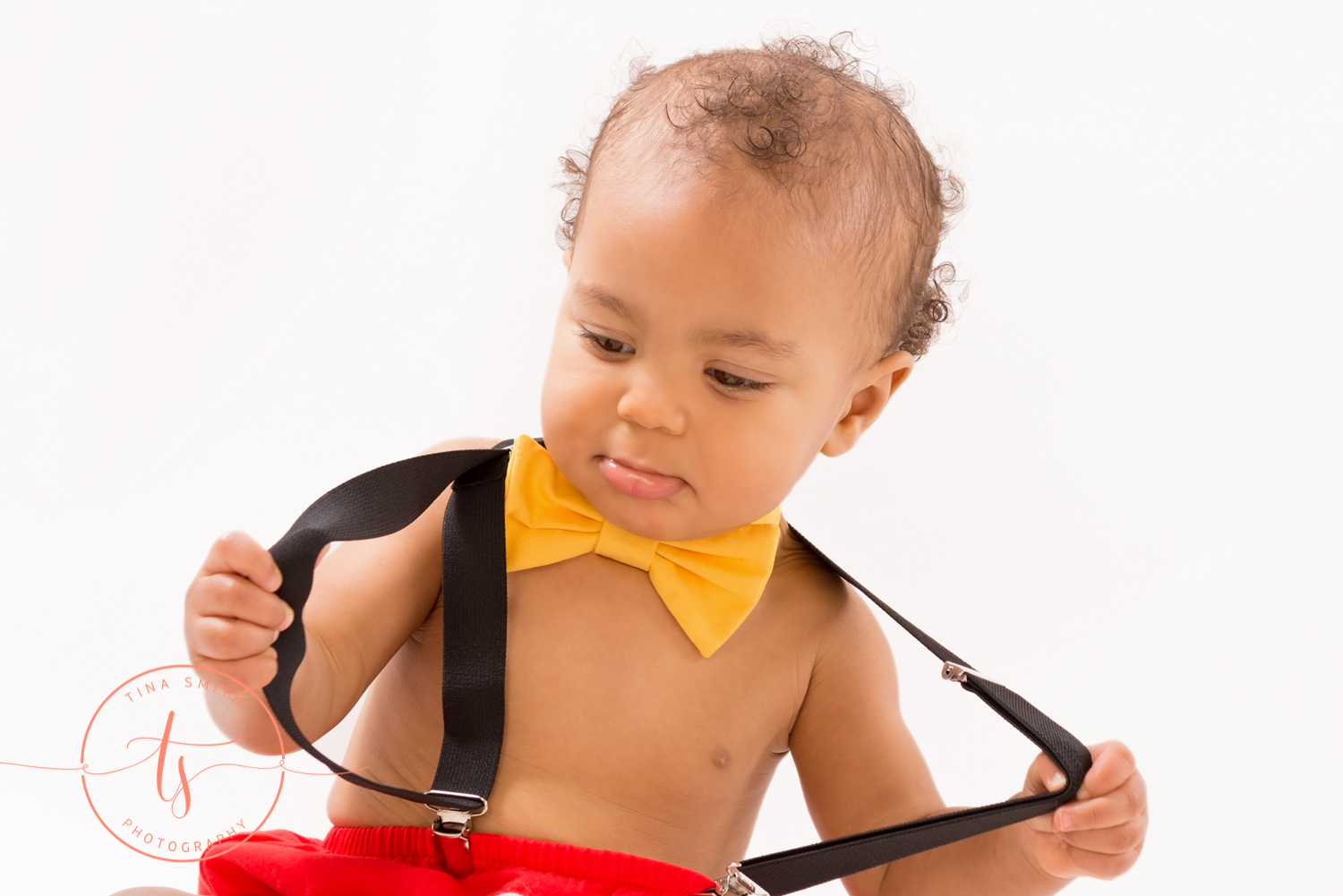 boy in mickey mouse suspenders