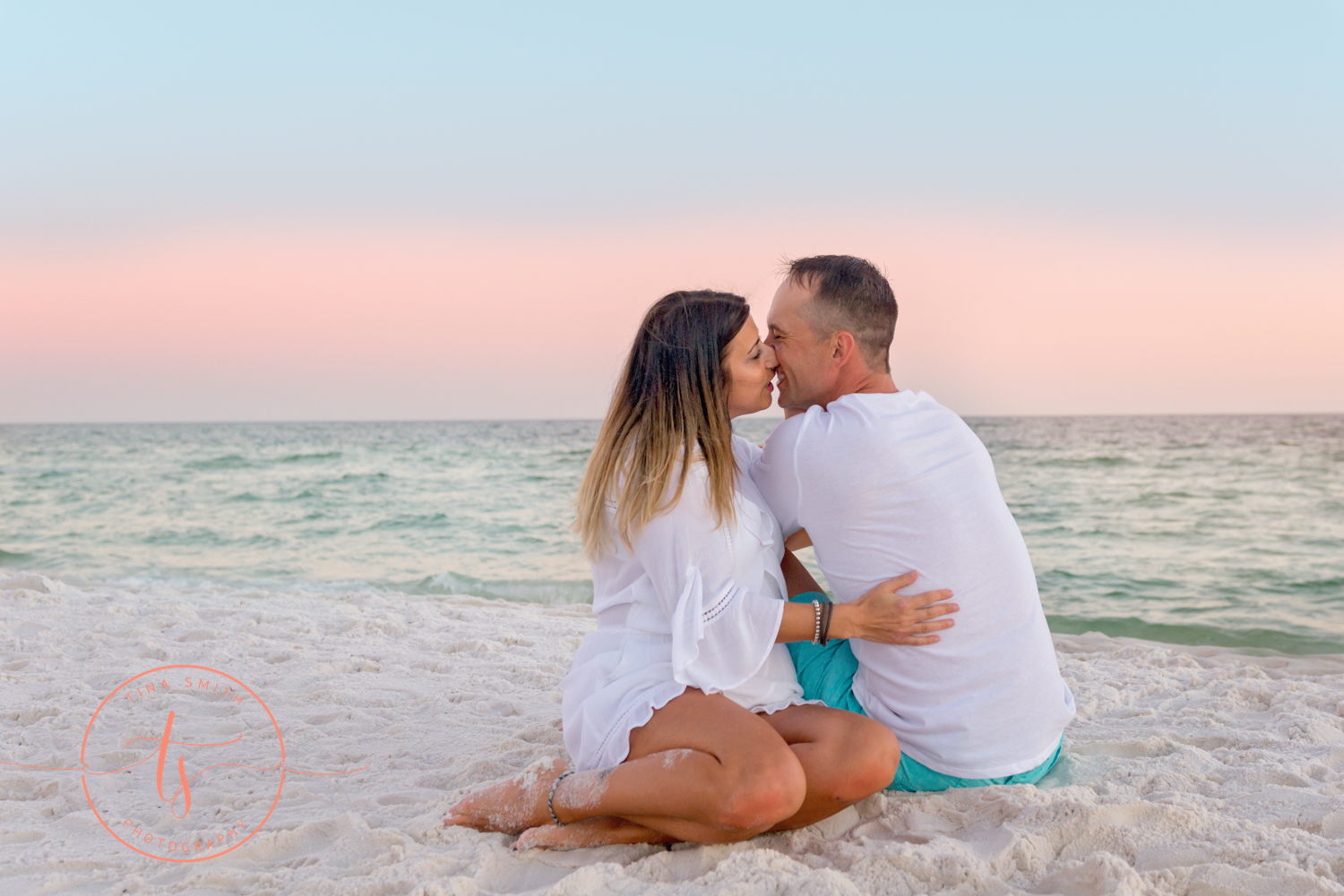 couple kissing on beach in destin for portraits