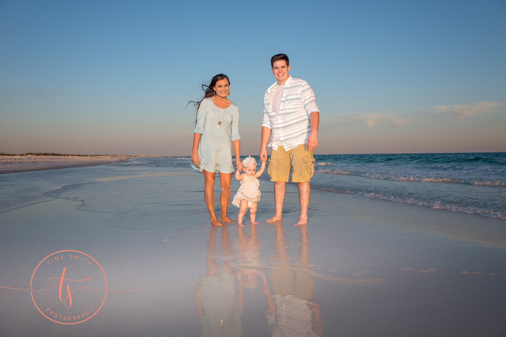 family walking down beach in destin