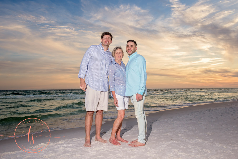 family posing on beach in miramar