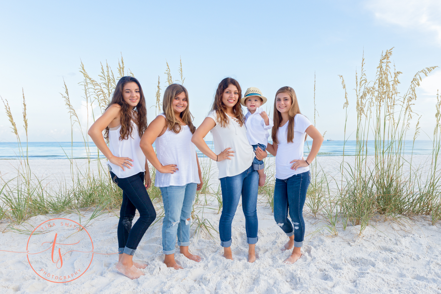 5 siblings posing on the beach for destin photographer