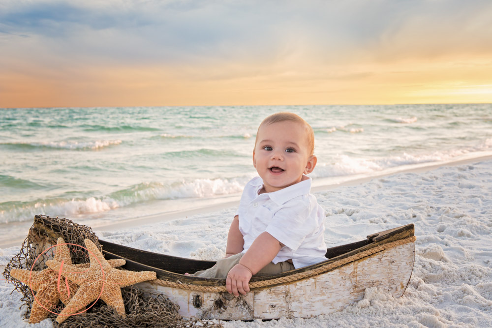 destin photographer boy in boat on beach