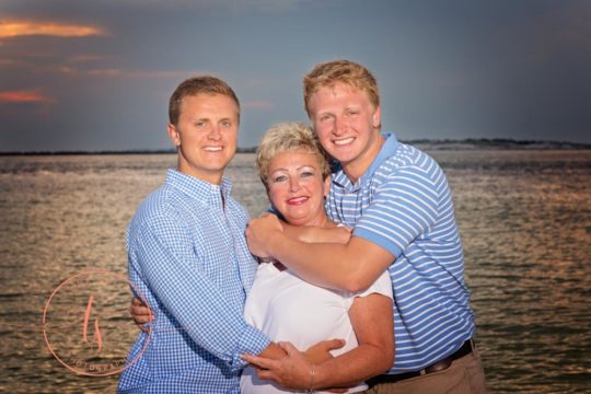 mom and sons posing for family portrait in destin