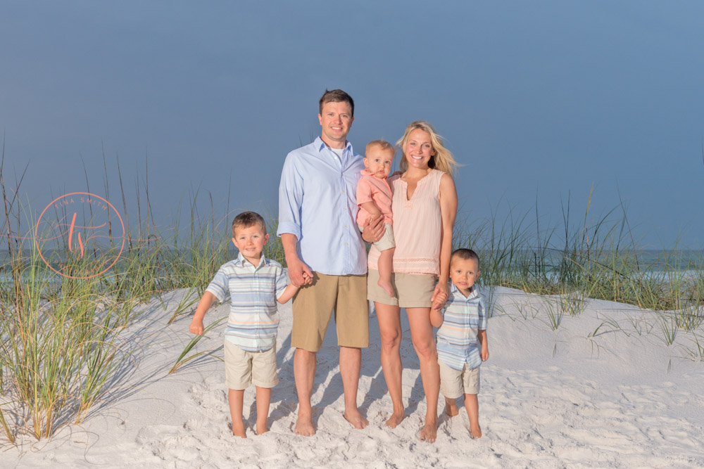 family on beach in destine at sunrise