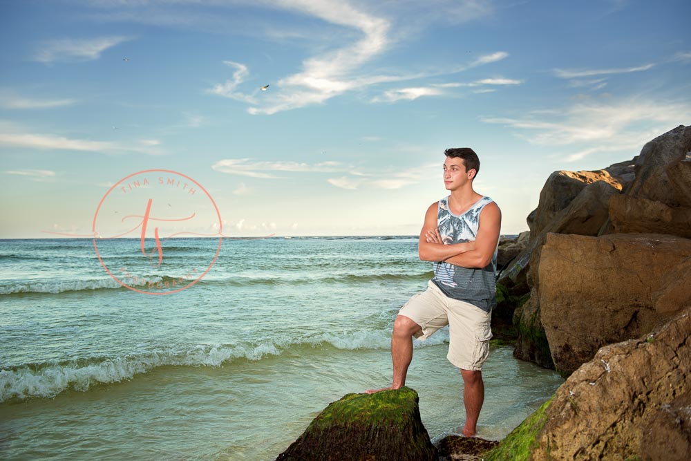 destin senior portraits photographer boy standing on the jetties