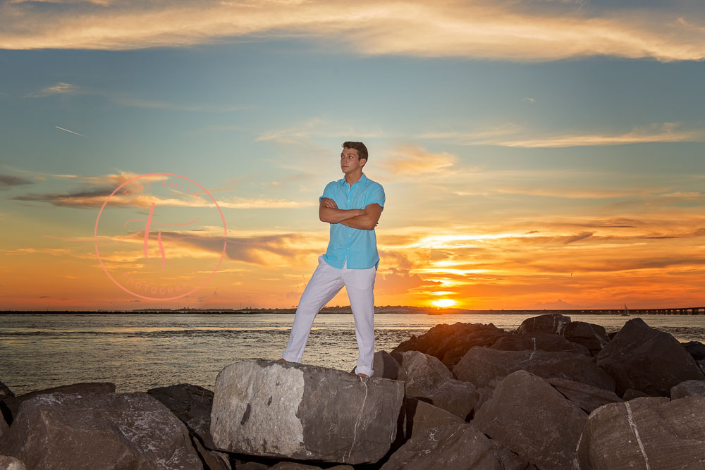 destin senior portraits photographer boy standing on the jetties