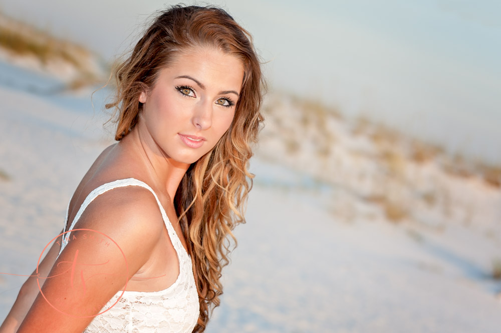 senior girl posing on the beach in destin