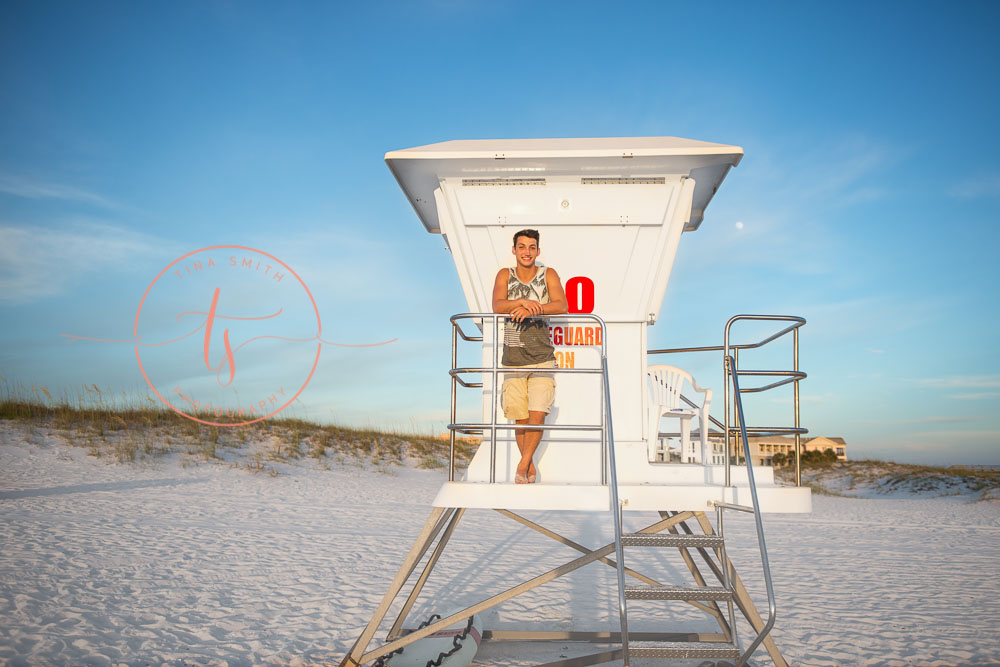 destin senior portraits photographer boy standing on the life guard stand