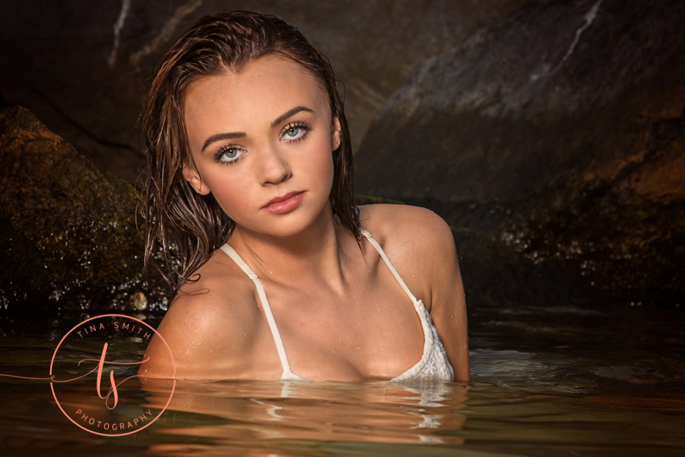 senior girl posing in water destin beach