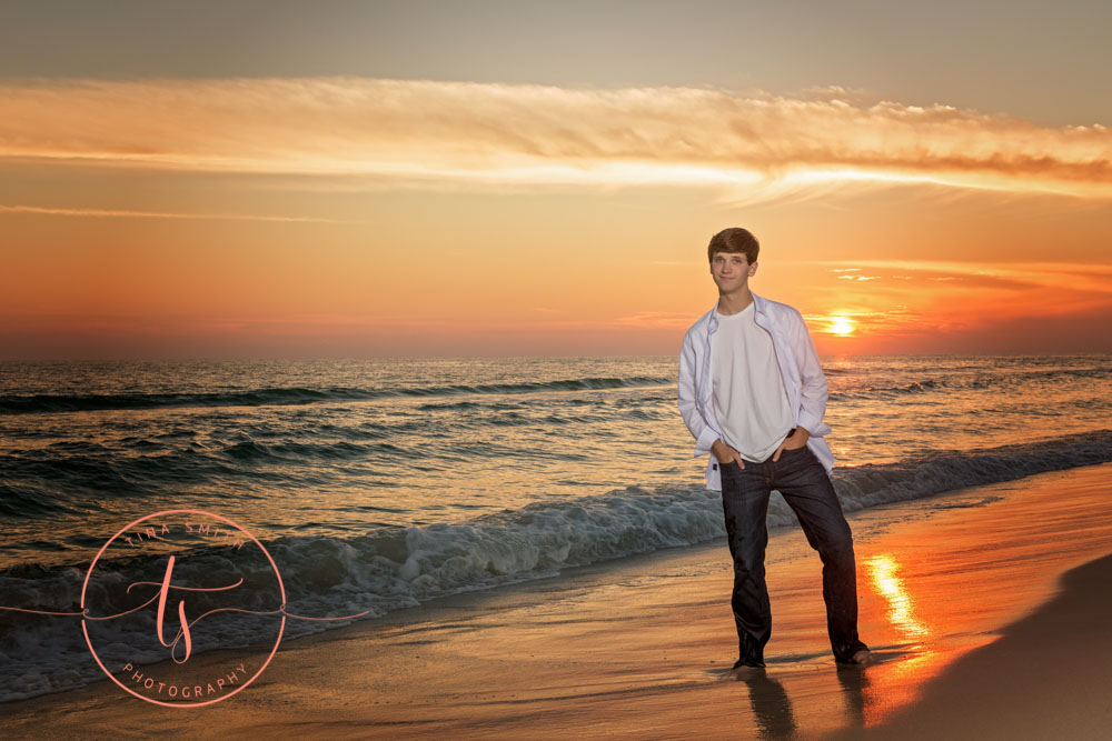 senior boy posing for photographer ft walton beach sunset