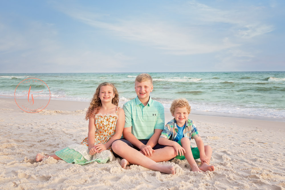 children sitting on rosemary beach