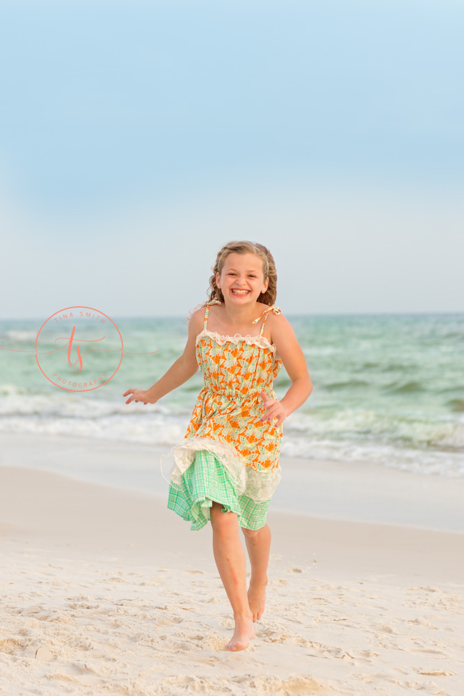 girl running on the beach rosemary beach photographer