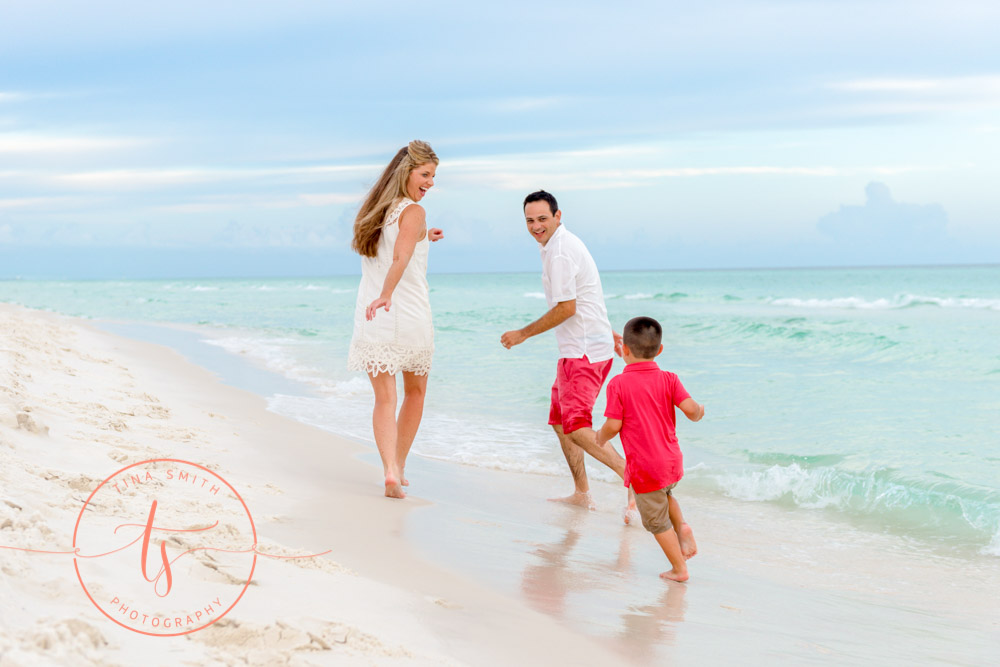 family playing on the beach in seacrest