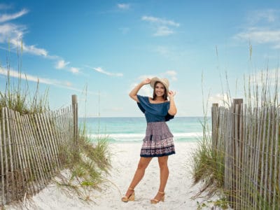 girl with hat on the beach destin